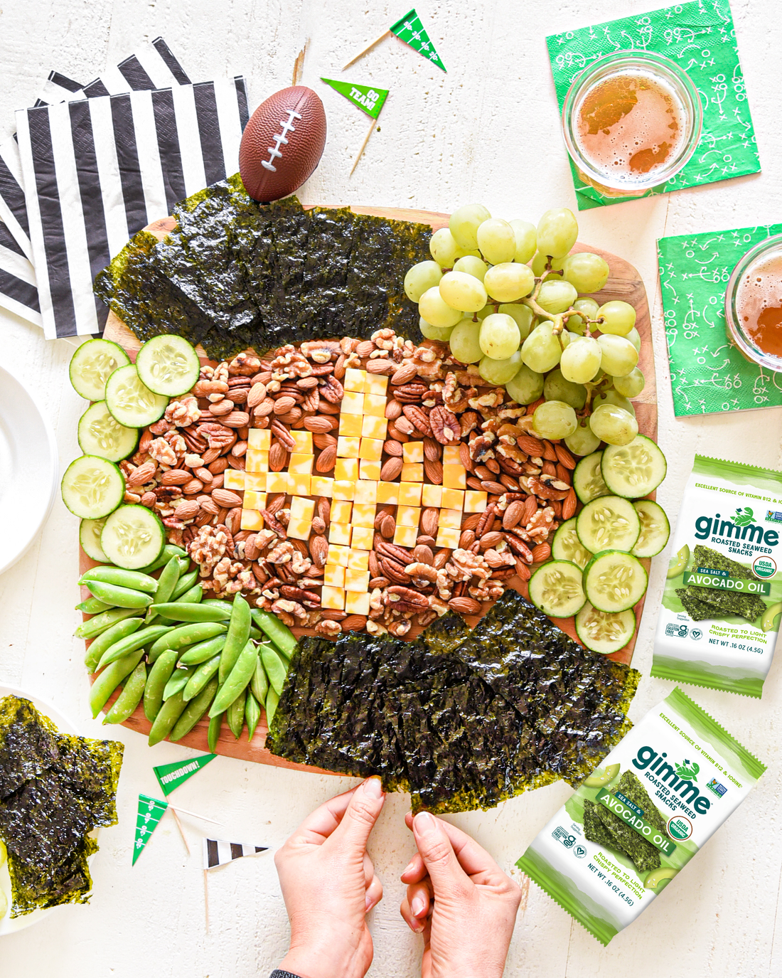 Football shaped snacks with gimme's avocado oil seaweed snacks.