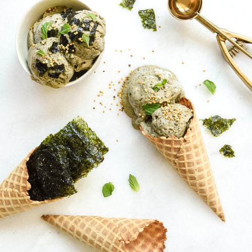 Ice cream cone with seaweed ice cream made with Gimme seaweed snacks.