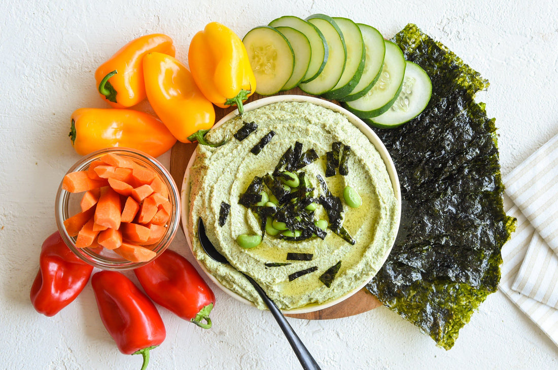 Edamame hummus with assorted vegetables and gimme seaweed snack.