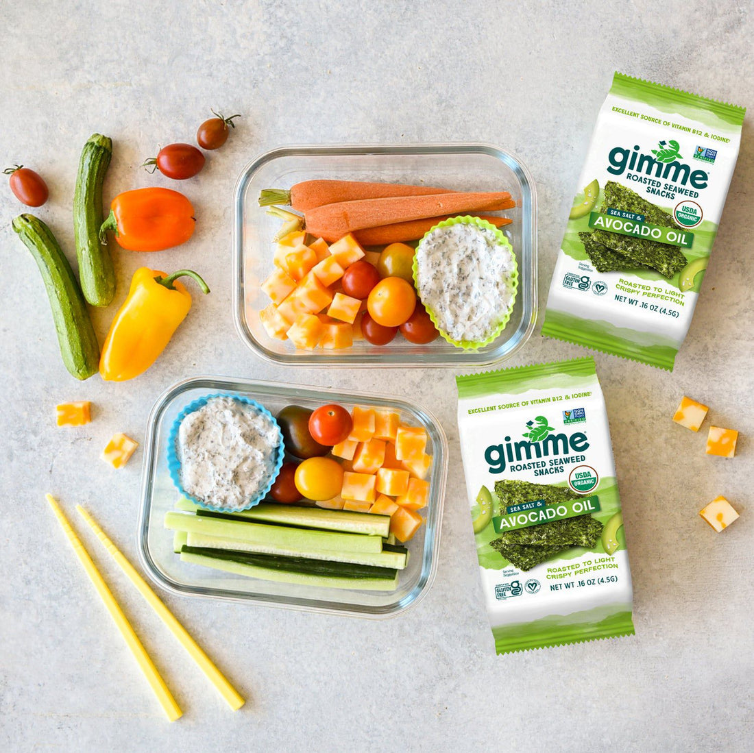 Healthy snack boxes with carrots, celery, cheese cubes and Gimme Seaweed snacks.