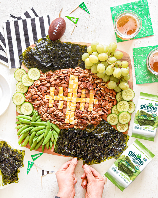Football shaped snacks with gimme's avocado oil seaweed snacks.