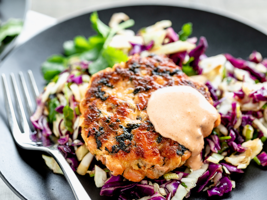 Salmon burger and seaweed slaw with gimme sea salt seaweed snack.