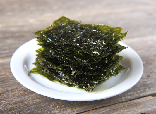 A stack of gimme seaweed on a plate.