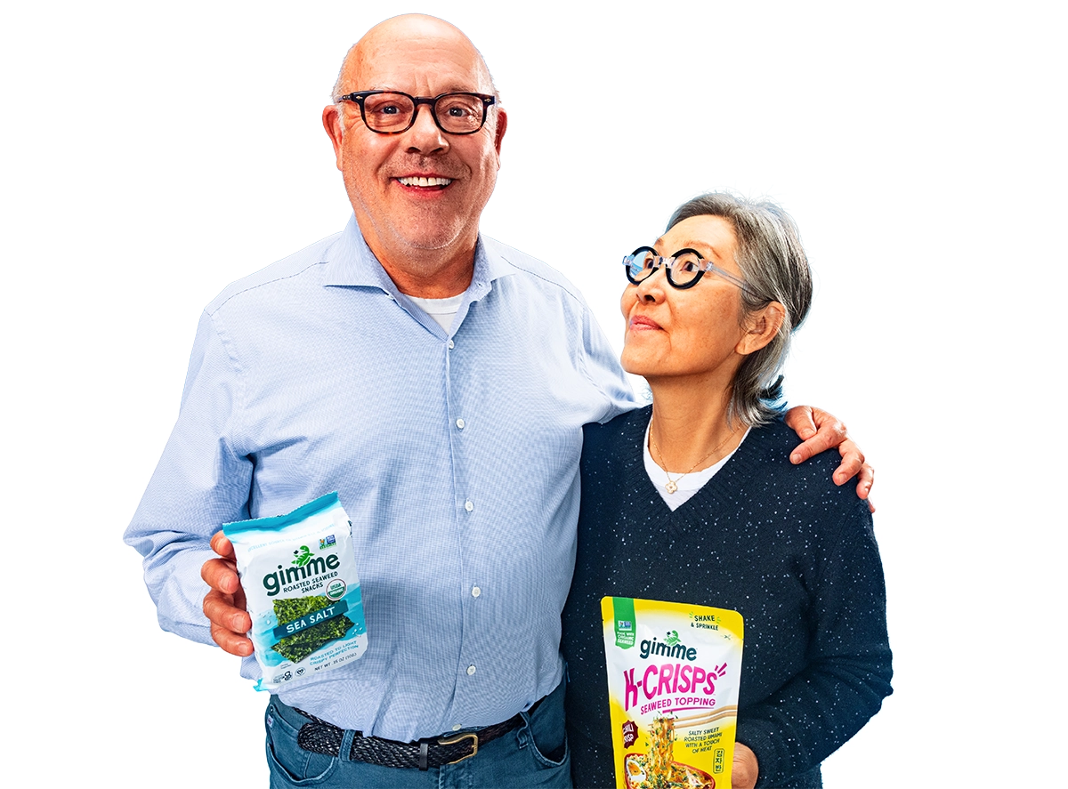 Gimme founders holding Gimme Crisps packages
